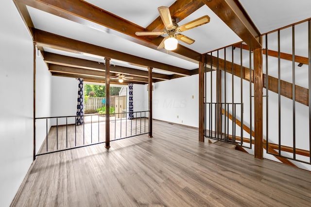 144 W Ticonderoga Dr Unit H, Westerville, OH 43081 - unfurnished room with a ceiling fan, wood finished floors, and beamed ceiling