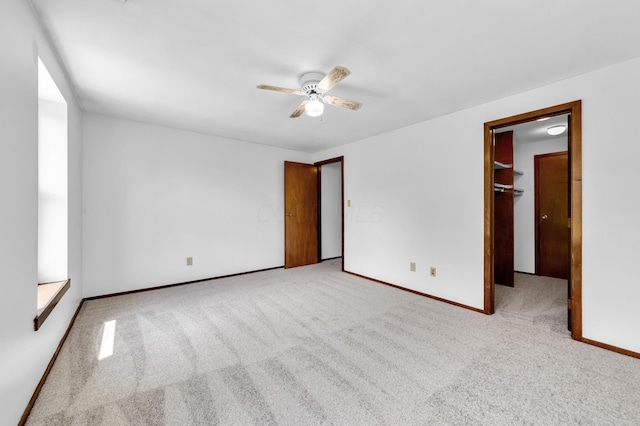 144 W Ticonderoga Dr Unit H, Westerville, OH 43081 - unfurnished bedroom with carpet floors, baseboards, a ceiling fan, and a spacious closet