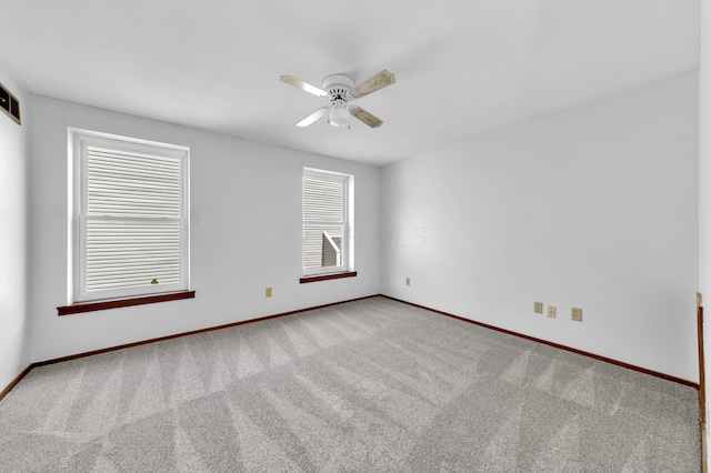 144 W Ticonderoga Dr Unit H, Westerville, OH 43081 - empty room featuring carpet flooring, baseboards, and a ceiling fan
