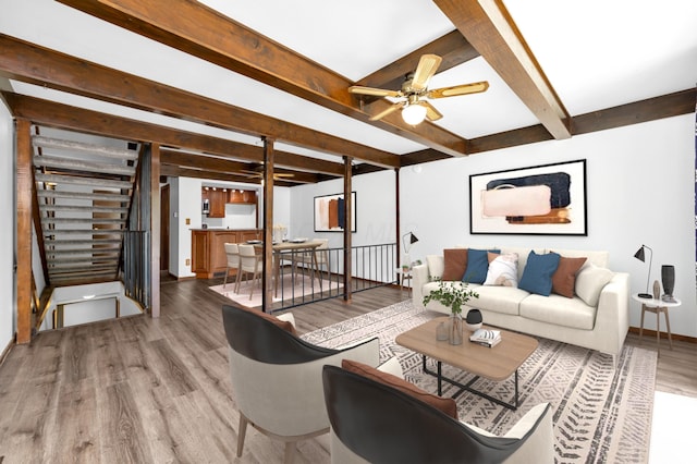 144 W Ticonderoga Dr Unit H, Westerville, OH 43081 - living room with ceiling fan, wood finished floors, beam ceiling, and baseboards