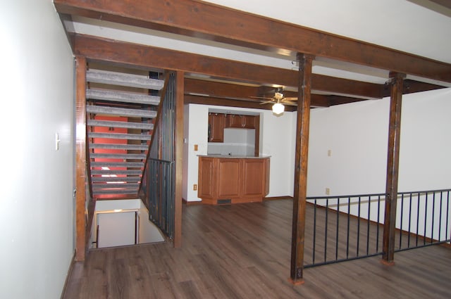 144 W Ticonderoga Dr Unit H, Westerville, OH 43081 - unfurnished living room featuring dark wood-type flooring, a ceiling fan, and beamed ceiling