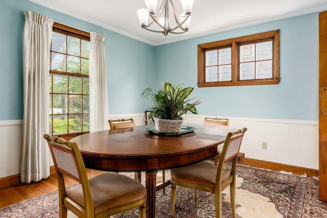 2731 E Broad St, Bexley, OH 43209 - dining room with a chandelier, light wood-style floors, ornamental molding, and baseboards
