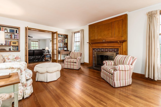 2731 E Broad St, Bexley, OH 43209 - living room with wood finished floors, a fireplace, and ornamental molding