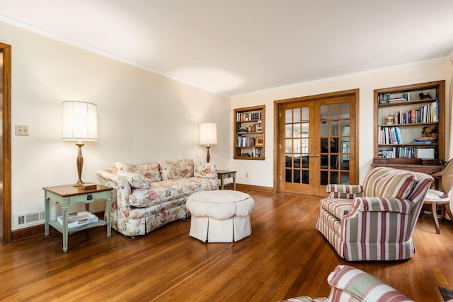 2731 E Broad St, Bexley, OH 43209 - living area featuring french doors, crown molding, wood finished floors, built in features, and baseboards