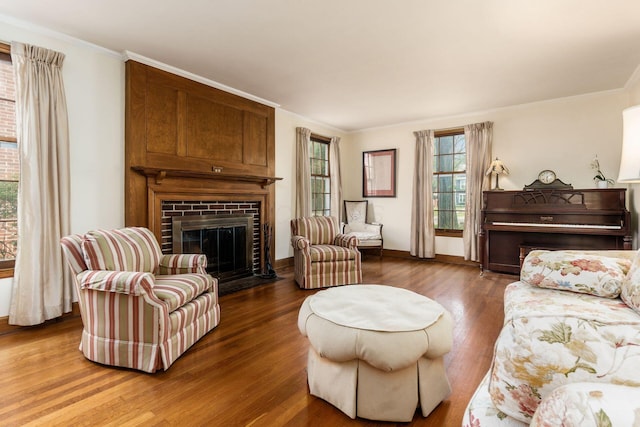 2731 E Broad St, Bexley, OH 43209 - living area featuring ornamental molding, a brick fireplace, wood finished floors, and baseboards