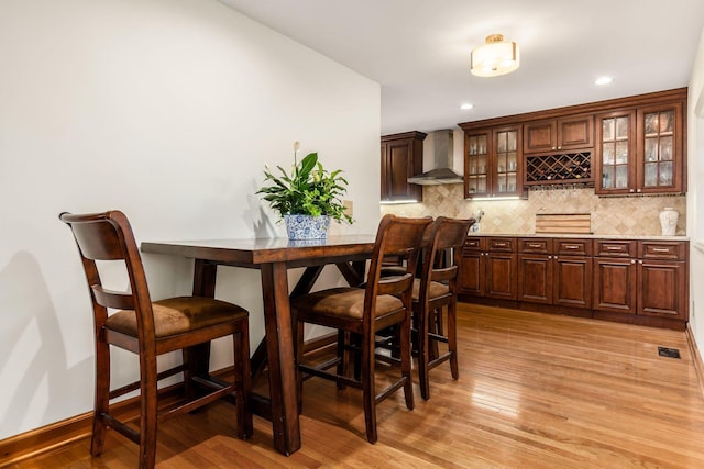 2731 E Broad St, Bexley, OH 43209 - dining space featuring light wood-type flooring, recessed lighting, baseboards, and bar
