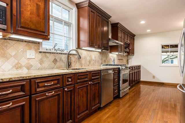 2731 E Broad St, Bexley, OH 43209 - kitchen featuring a sink, appliances with stainless steel finishes, baseboards, light stone counters, and recessed lighting