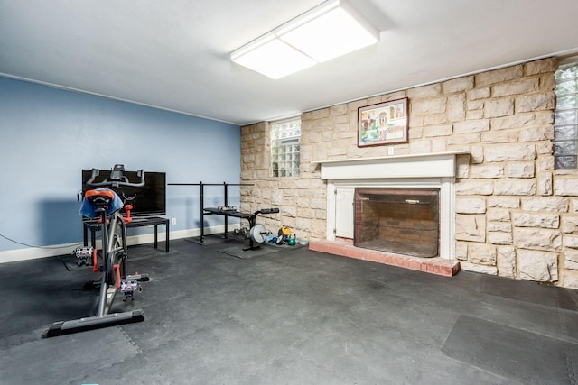 2731 E Broad St, Bexley, OH 43209 - workout room featuring a fireplace with raised hearth, baseboards, and healthy amount of natural light