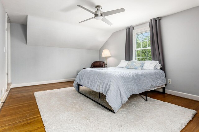 2731 E Broad St, Bexley, OH 43209 - bedroom with wood finished floors, lofted ceiling, baseboards, and a ceiling fan