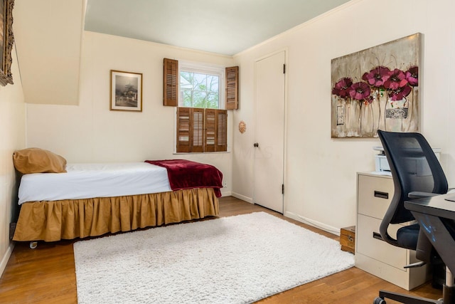 2731 E Broad St, Bexley, OH 43209 - bedroom with wood finished floors, an office area, baseboards, and ornamental molding