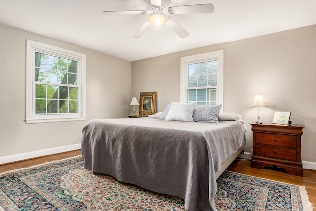 2731 E Broad St, Bexley, OH 43209 - bedroom with multiple windows, baseboards, wood finished floors, and ceiling fan