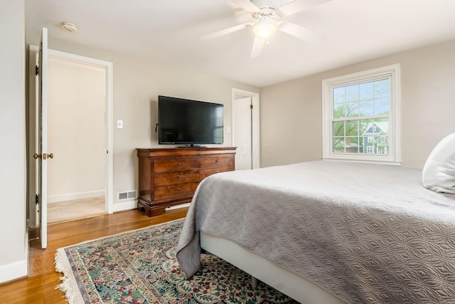 2731 E Broad St, Bexley, OH 43209 - bedroom with wood finished floors, a ceiling fan, and baseboards