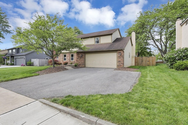 traditional-style home with asphalt driveway, a chimney, an attached garage, and brick siding