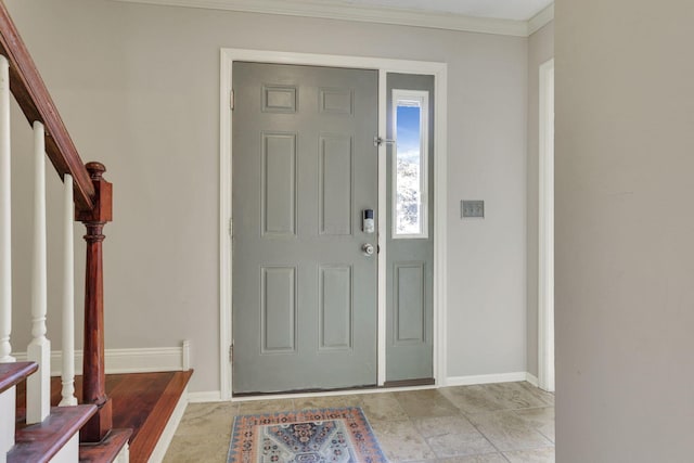 entryway featuring stairs, baseboards, and crown molding