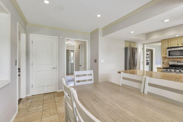 dining space with baseboards, ornamental molding, recessed lighting, and light stone finish floors