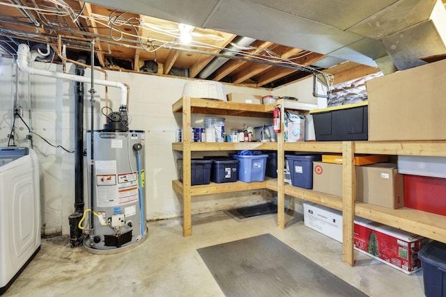 unfinished basement with water heater, washer / dryer, and a workshop area