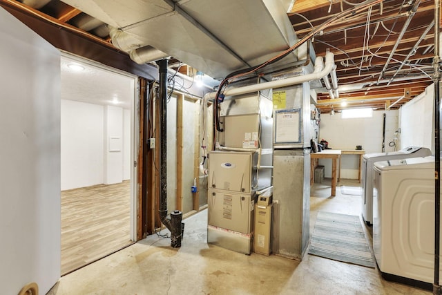 basement with independent washer and dryer and heating unit
