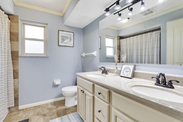 bathroom with toilet, ornamental molding, baseboards, double vanity, and a shower with curtain