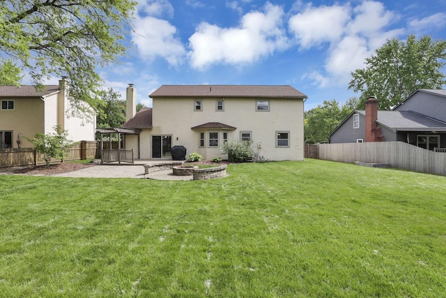 back of house with a patio and stucco siding