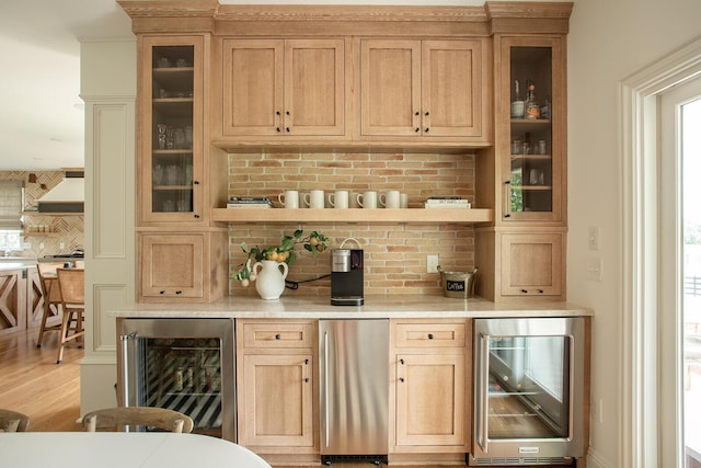 8070 Harriott Rd, Dublin, OH 43017 - indoor dry bar with wine cooler, decorative backsplash, light wood finished floors, and custom exhaust hood