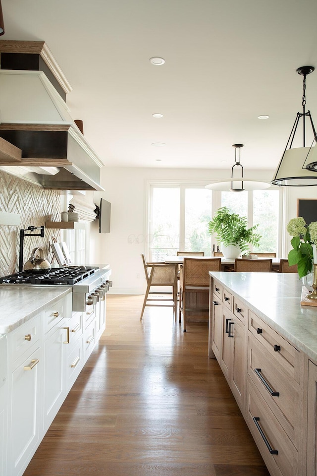 8070 Harriott Rd, Dublin, OH 43017 - kitchen featuring plenty of natural light, stainless steel gas stovetop, decorative backsplash, hanging light fixtures, and recessed lighting