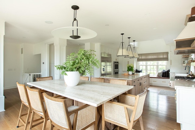 8070 Harriott Rd, Dublin, OH 43017 - dining room with light wood-style flooring