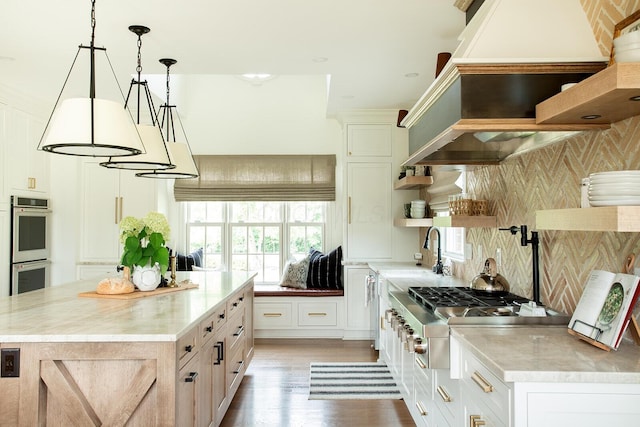8070 Harriott Rd, Dublin, OH 43017 - kitchen with open shelves, stainless steel appliances, custom exhaust hood, and healthy amount of natural light