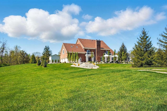 8070 Harriott Rd, Dublin, OH 43017 - back of property with a lawn and a chimney