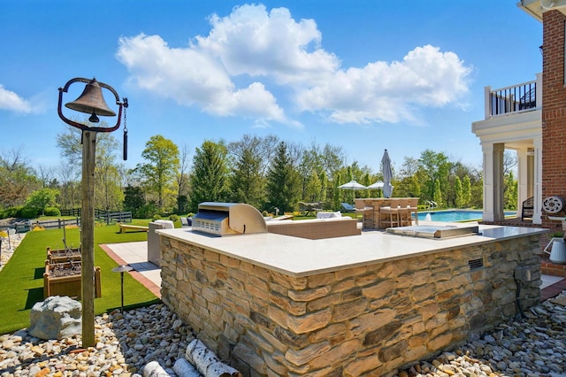 8070 Harriott Rd, Dublin, OH 43017 - view of patio / terrace with exterior kitchen, a balcony, and grilling area