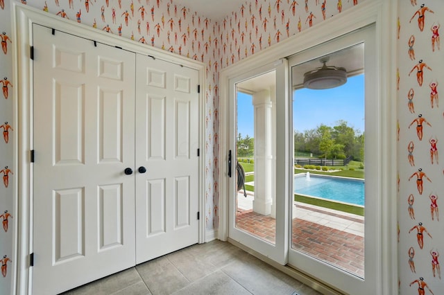 8070 Harriott Rd, Dublin, OH 43017 - doorway to outside with wallpapered walls