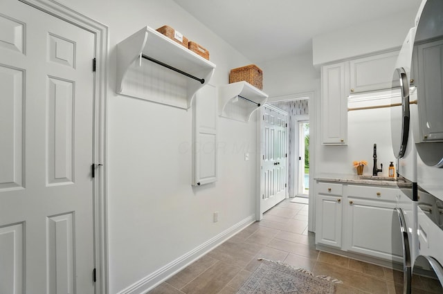 8070 Harriott Rd, Dublin, OH 43017 - interior space featuring a sink and light tile patterned floors