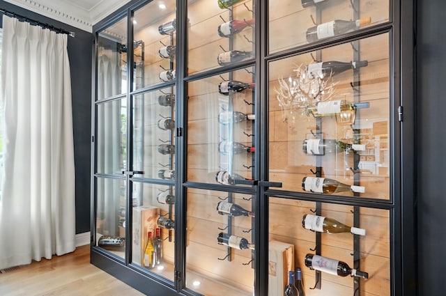 8070 Harriott Rd, Dublin, OH 43017 - wine room featuring wood finished floors and crown molding
