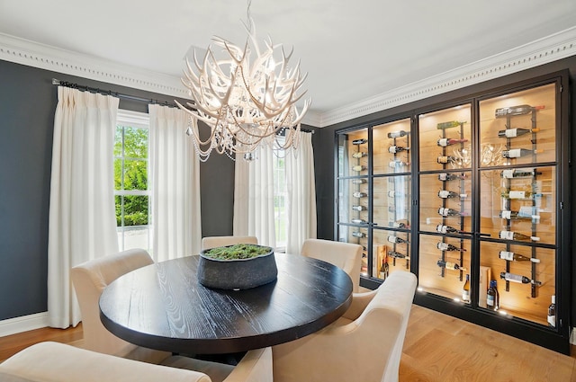8070 Harriott Rd, Dublin, OH 43017 - dining space featuring a chandelier, crown molding, and wood finished floors