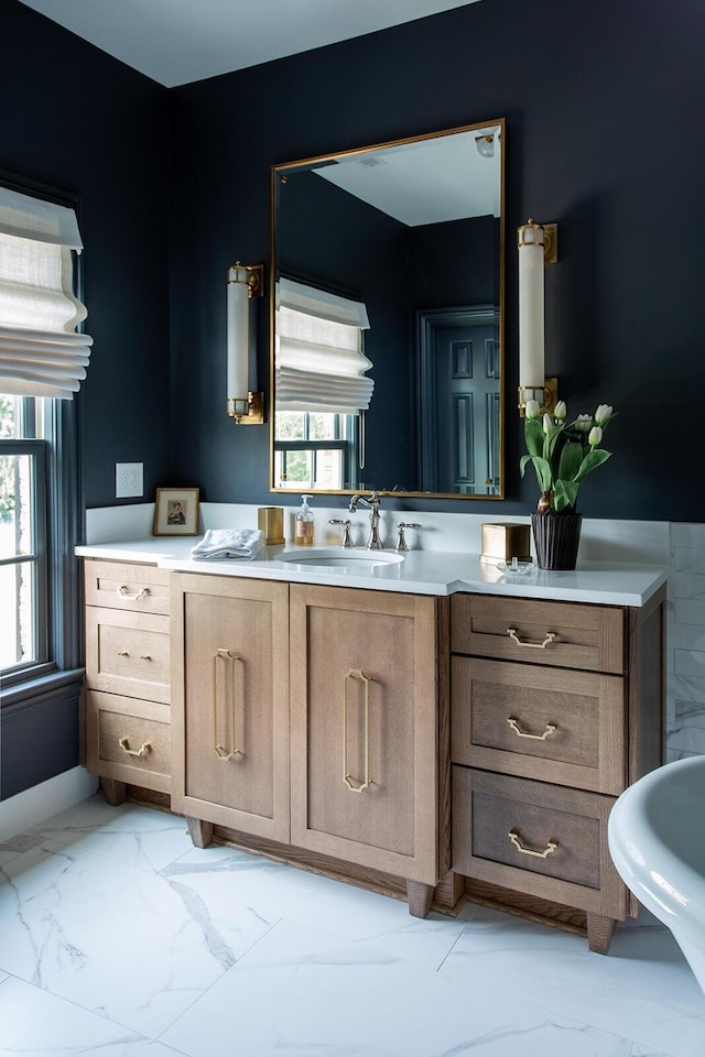 8070 Harriott Rd, Dublin, OH 43017 - bathroom with marble look tiles and vanity