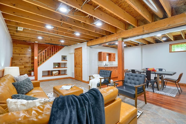 living room with stairs and wood finished floors