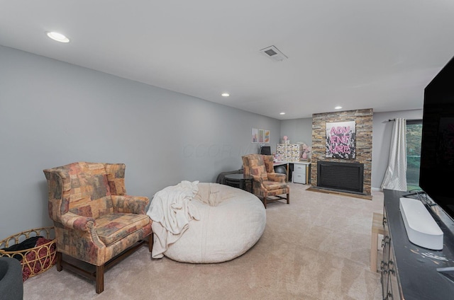 living area with light carpet, a fireplace, and recessed lighting