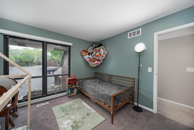 bedroom featuring carpet and baseboards
