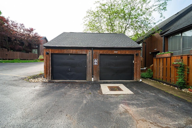 garage featuring fence