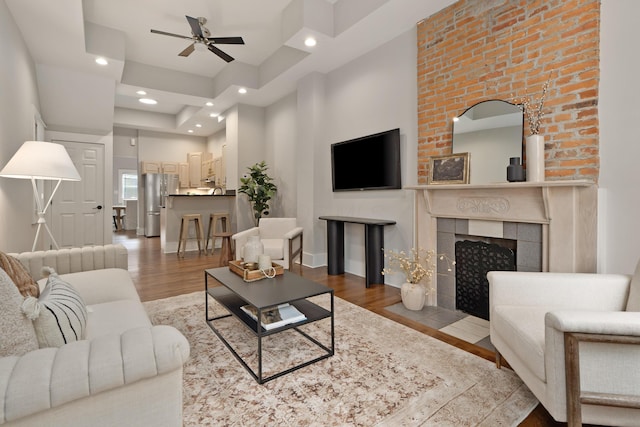 411 Reinhard Ave, Columbus, OH 43206 - living area with wood finished floors, ceiling fan, recessed lighting, a fireplace, and baseboards