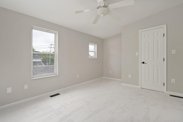 411 Reinhard Ave, Columbus, OH 43206 - unfurnished room with light colored carpet, baseboards, and a ceiling fan