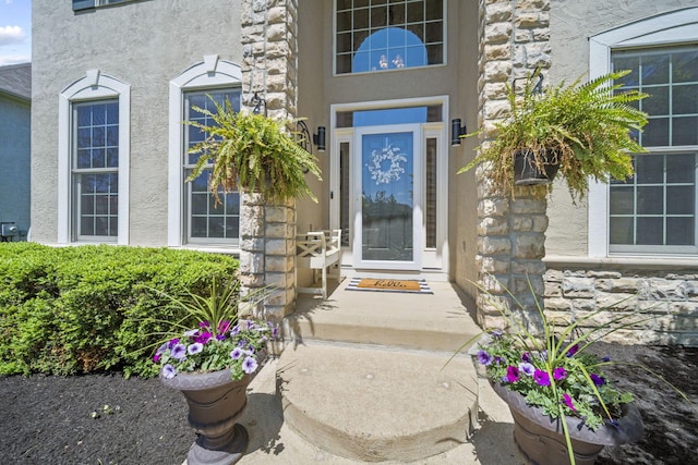 2557 Coltsbridge Dr, Lewis Center, OH 43035 - view of exterior entry featuring stone siding and stucco siding
