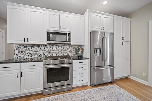 2557 Coltsbridge Dr, Lewis Center, OH 43035 - kitchen featuring stainless steel appliances, recessed lighting, baseboards, decorative backsplash, and light wood-style flooring