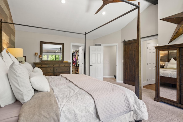 2557 Coltsbridge Dr, Lewis Center, OH 43035 - carpeted bedroom featuring lofted ceiling, a walk in closet, a closet, recessed lighting, and a barn door