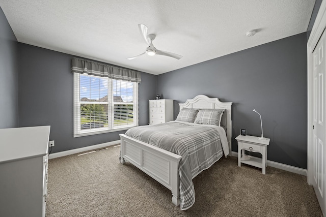 2557 Coltsbridge Dr, Lewis Center, OH 43035 - bedroom featuring carpet flooring, baseboards, ceiling fan, a closet, and a textured ceiling