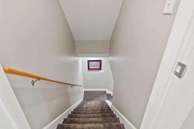 2557 Coltsbridge Dr, Lewis Center, OH 43035 - stairs featuring carpet floors, a textured ceiling, and baseboards