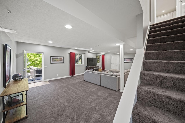 2557 Coltsbridge Dr, Lewis Center, OH 43035 - living room with dark carpet, stairs, recessed lighting, baseboards, and a textured ceiling