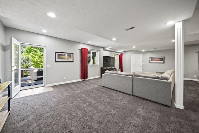 2557 Coltsbridge Dr, Lewis Center, OH 43035 - living area featuring carpet flooring, recessed lighting, baseboards, healthy amount of natural light, and a textured ceiling