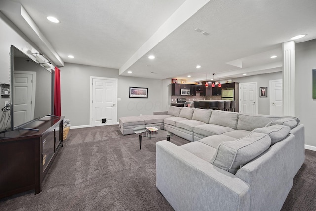 2557 Coltsbridge Dr, Lewis Center, OH 43035 - living area with dark carpet, recessed lighting, and baseboards