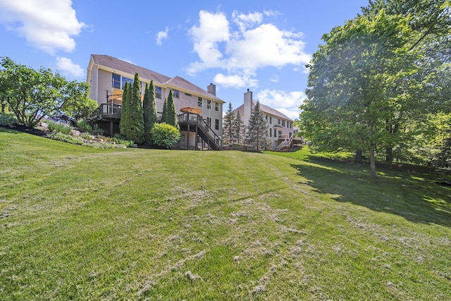 2557 Coltsbridge Dr, Lewis Center, OH 43035 - view of grassy yard with stairway and a deck