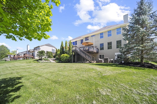 2557 Coltsbridge Dr, Lewis Center, OH 43035 - view of community with stairway, a wooden deck, and a lawn